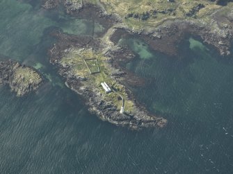 Oblique aerial view centred on Oronsay Lighthouse, Skye with the adjacent cottages, taken from the E.
