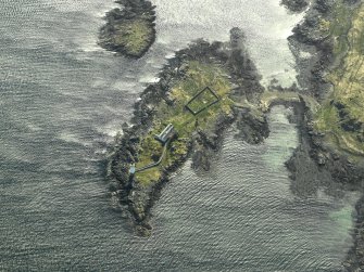 Oblique aerial view centred on Oronsay Lighthouse, Skye with adjacent cottages, taken from the NE.