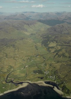 General oblique aerial view looking towards Glen More centred on the remains of the Barracks and the adjacent modern village, taken from the W.