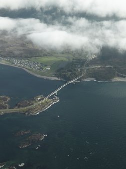 Oblique aerial view centred on the main span of the road bridge with the adjacent village of Caol Acain (Kyleakin), taken from the N.