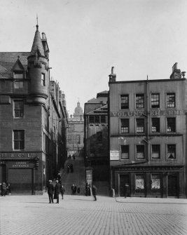 Photograph of Heriot Bridge and Nos 45 and 61 either side with accompanying text, inscr; 'Grassmarket - south side, Heriot Bridge.'
