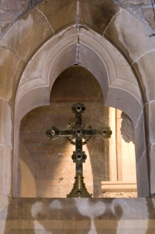 Interior. Detail of cross above vestry door