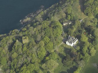 Oblique aerial view of the country house and the remains of the castle, taken from the SE.