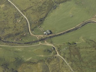 Oblique aerial view centred on the remains of the township, taken from the NE.