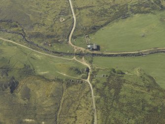 Oblique aerial view centred on the remains of the township, taken from the NNE.