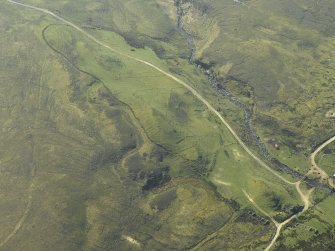 Oblique aerial view centred on the remains of the township, taken from the N.