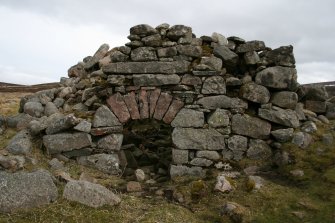 View of limekiln taken from the WNW, showing the detail of the pink granite voussoirs over the opening.