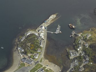 Oblique aerial view centred on the harbour and slipway, taken from the SW.
