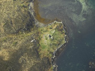 Oblique aerial view centred on the remains of the towerhouse, taken from the E.