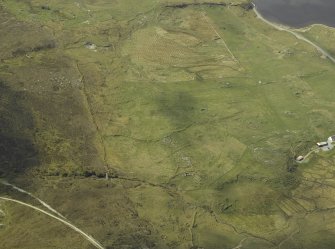 General oblique aerial view of the remains of the township and manse, taken from the ENE.