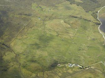 General oblique aerial view of the remains of the township and manse, taken from the SW.