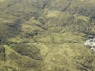 Oblique aerial view centred on the remains of the township, taken from the NE.