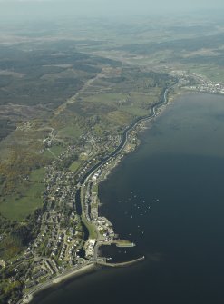 General oblique aerial view looking up the loch across the village and the canal towards the town, taken from the S.