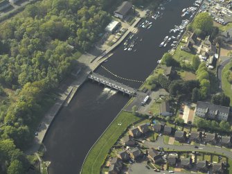 Oblique aerial view centred on the weir, taken from the SE.