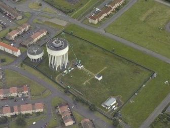 Oblique aerial view centred on the water tower, taken from the SW.