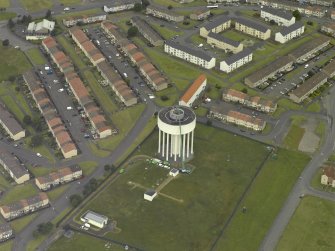 Oblique aerial view centred on the water tower, taken from the SSE.