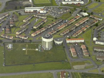 Oblique aerial view centred on the water tower, taken from the E.