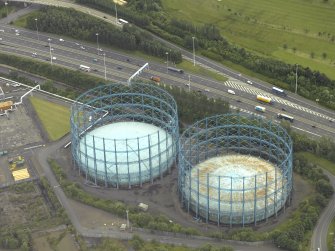 Oblique aerial view centred on the gas holders, taken from the NW.