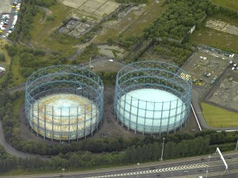 Oblique aerial view centred on the gas holders, taken from the SSE.