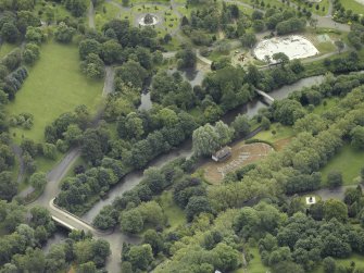 Oblique aerial view centred on the bridge with the band stand adjacent, taken from the NNW.