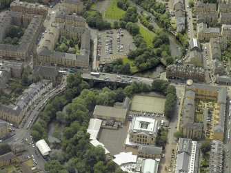 Oblique aerial view centred on the bridge with Glasgow Academy adjacent, taken from the N.