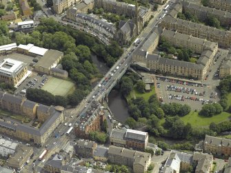 Oblique aerial view centred on the bridge with Glasgow Academy adjacent, taken from the W.