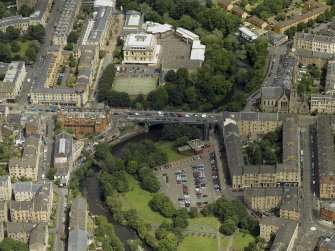 Oblique aerial view centred on the bridge with Glasgow Academy adjacent, taken from the S.