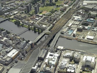 Oblique aerial view centred on the railway bridge and road bridges, taken from the N.