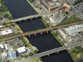 Oblique aerial view of the river centred on the bridges with the mosque adjacent, taken from the SSE.