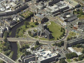 Oblique aerial view centred on the abbey with the Town Hall adjacent, taken from the SE.