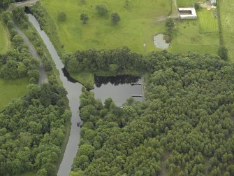 Oblique aerial view centred on the basin and canal, taken from the N.