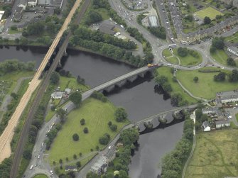 Oblique aerial view centred on the bridges, taken from the N.