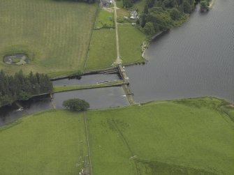 Oblique aerial view centred on the sluice and fish ladder, taken from the NW.