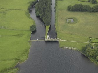 Oblique aerial view centred on the sluice and fish ladder, taken from the SW.