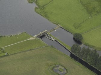 Oblique aerial view centred on the sluice and fish ladder, taken from the E.