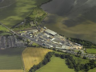 Oblique aerial view centred on the town and paper mill, taken from the SW.