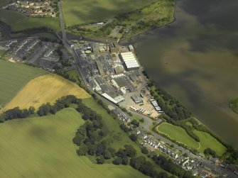 Oblique aerial view centred on the town and paper mill, taken from the SSW.