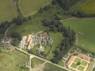Oblique aerial view centred on the Abbey and church, taken from the SW.