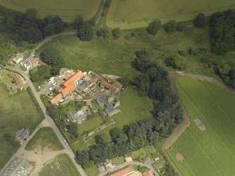 Oblique aerial view centred on the Abbey and church, taken from the WSW.