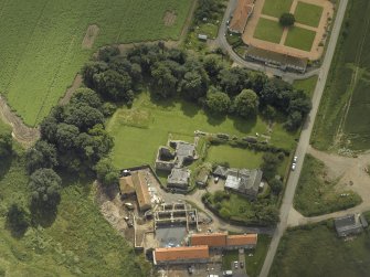 Oblique aerial view centred on the Abbey and church, taken from the N.