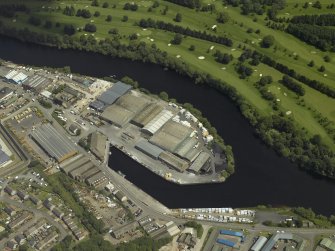 Oblique aerial view centred on the harbour, taken from the W.