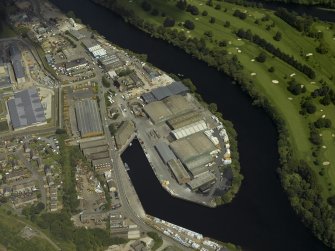 Oblique aerial view centred on the harbour, taken from the W.