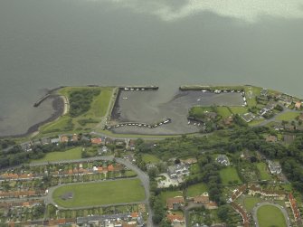 Oblique aerial view centred on the harbour, taken from the N.