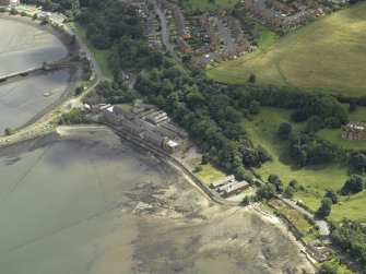 Oblique aerial view centred on part of the former Royal Naval Base, taken from the WNW.
