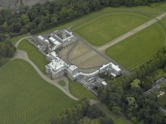 Oblique aerial view centred on the house, taken from the SW.