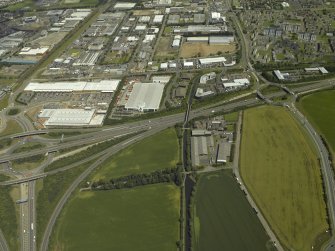 General oblique aerial view centred on the industrial estate and housing estate, taken from the SW.