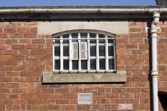Detail.  Exterior view of cell window with iron bars.