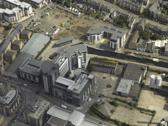 Oblique aerial view centred on the canal terminus with the new developments at Edinburgh Quay adjacent, taken from the NW.