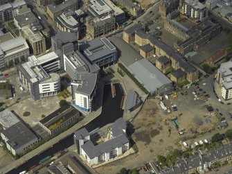 Oblique aerial view centred on the canal terminus with the new developments at Edinburgh Quay adjacent, taken from the SW.