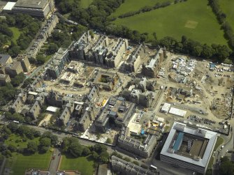 Oblique aerial view centred on the former Royal Infirmary, now Quartermile re-development, taken from the NW.